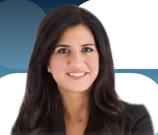 Guest speaker Fotini Iconomopoulos facing camera with a blue and white background