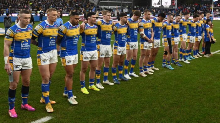 Leeds Rhinos rugby team assembled on the pitch